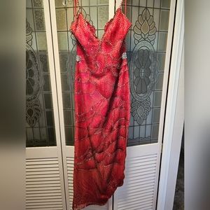 This is a beautiful red beaded gown